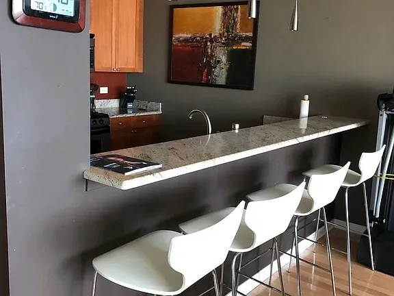 a picture of a table and chairs in a kitchen