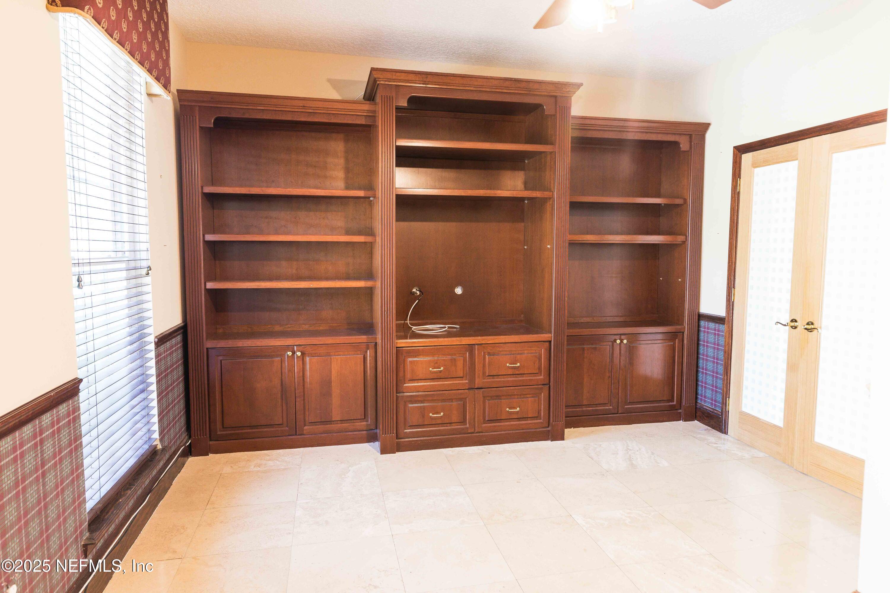 9912 Margate Hills Road Jacksonville, FL 32256 - Photo 15 of 17 a room with closet and furniture