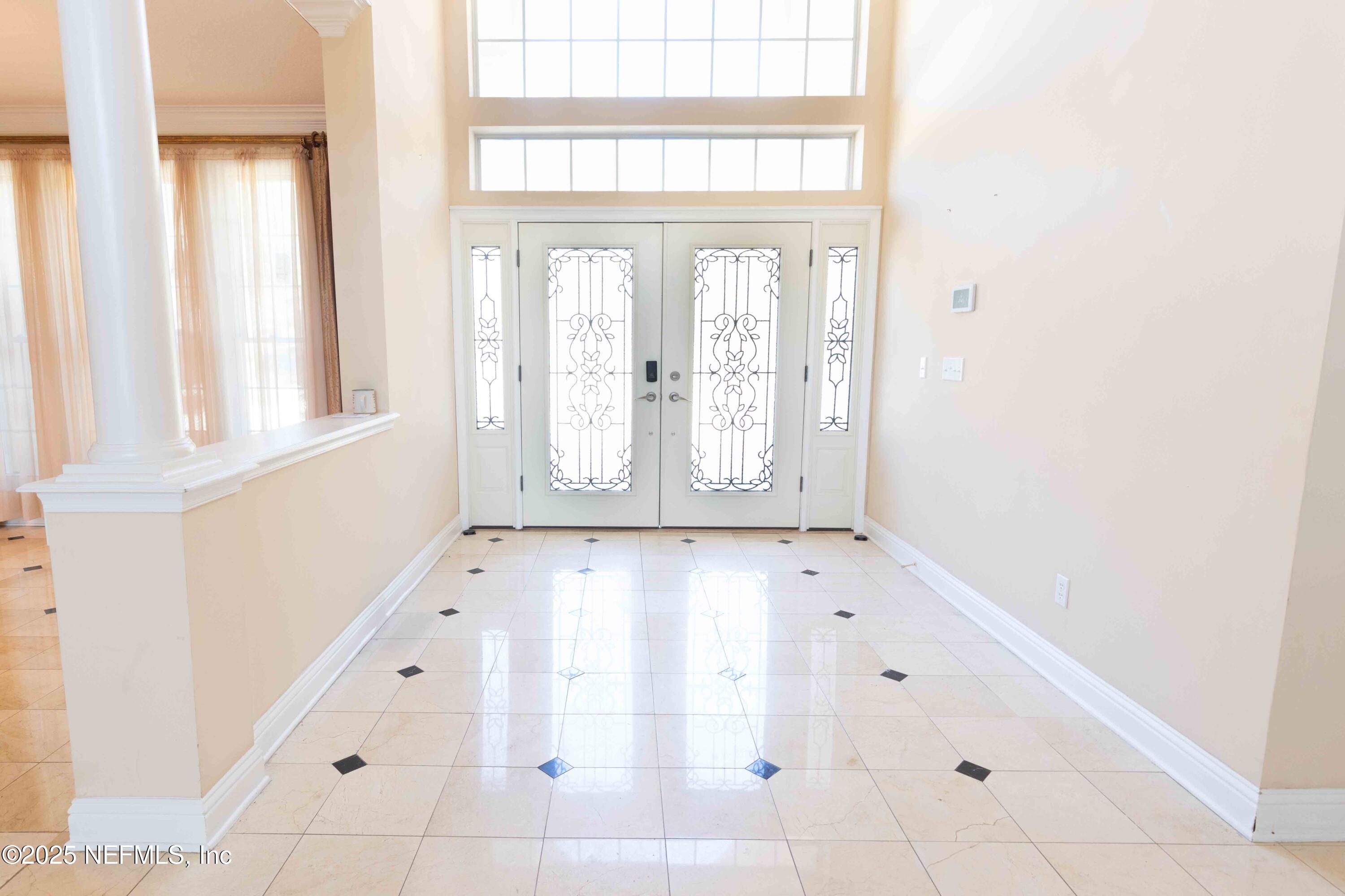 9912 Margate Hills Road Jacksonville, FL 32256 - Photo 2 of 17 an empty room with windows