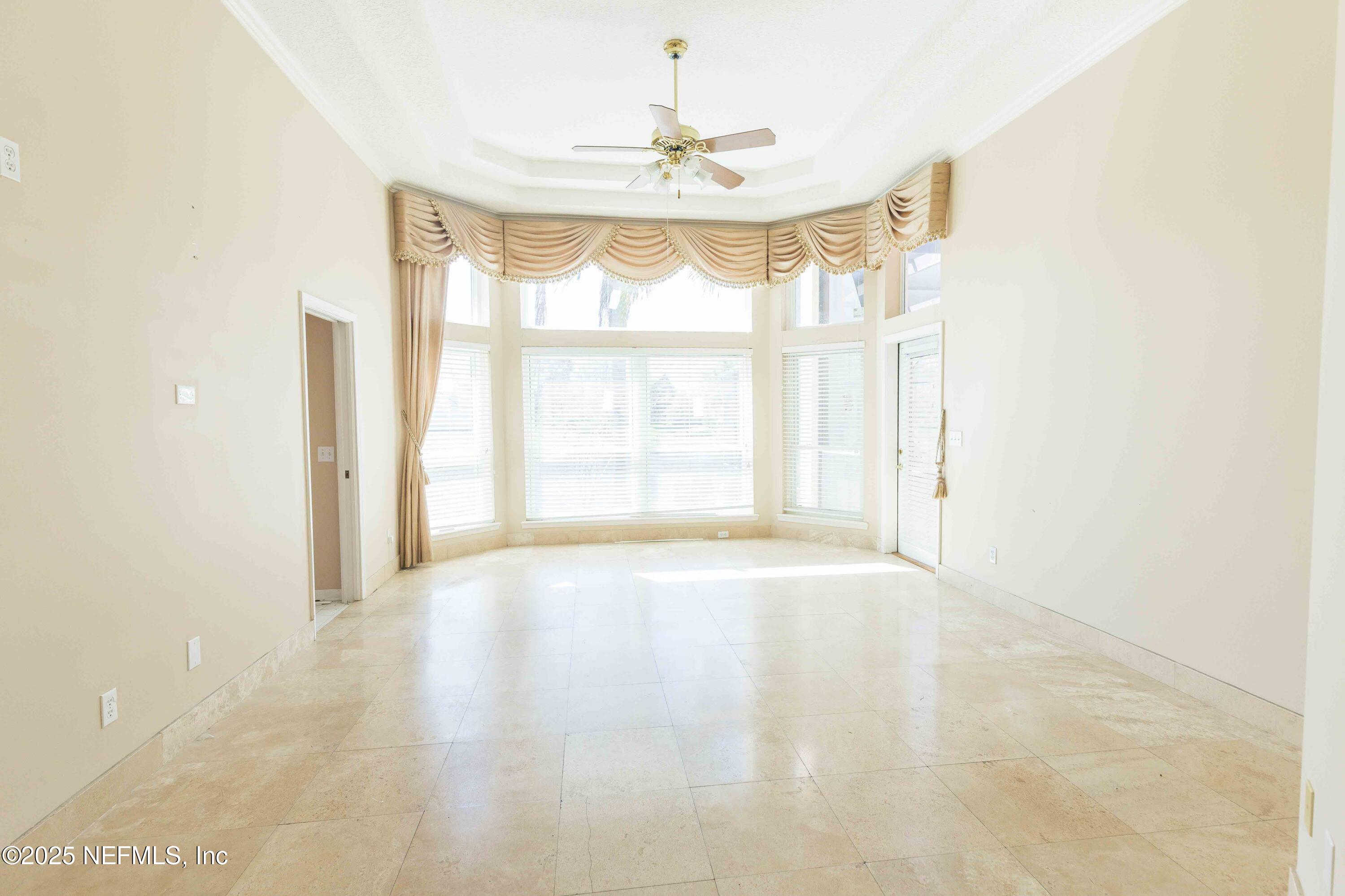 9912 Margate Hills Road Jacksonville, FL 32256 - Photo 8 of 17 a view of an empty room with a window