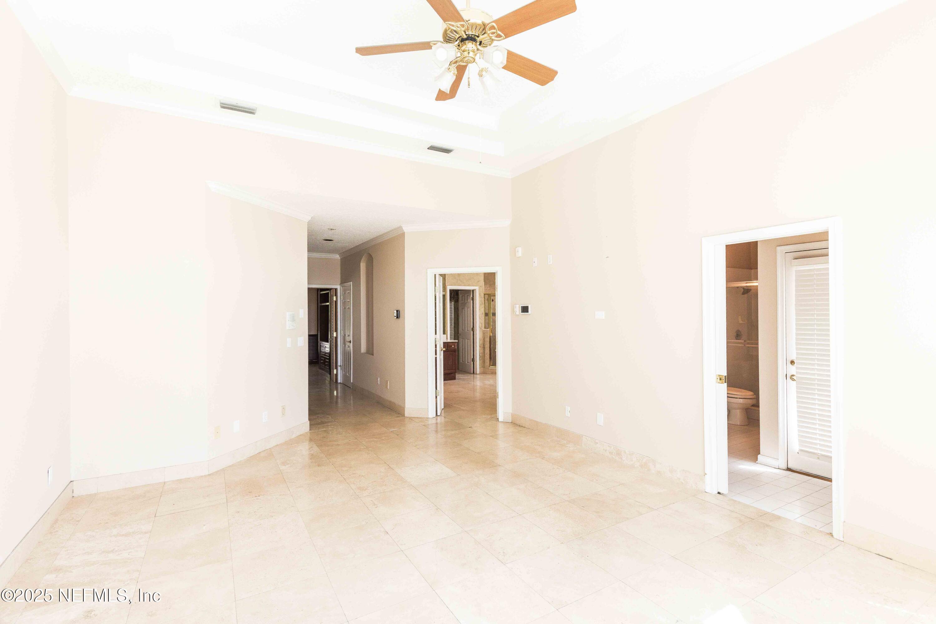 9912 Margate Hills Road Jacksonville, FL 32256 - Photo 9 of 17 a view of a livingroom with a ceiling fan