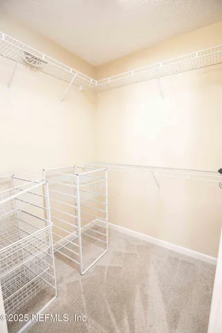 a view of a room with racks on the wall