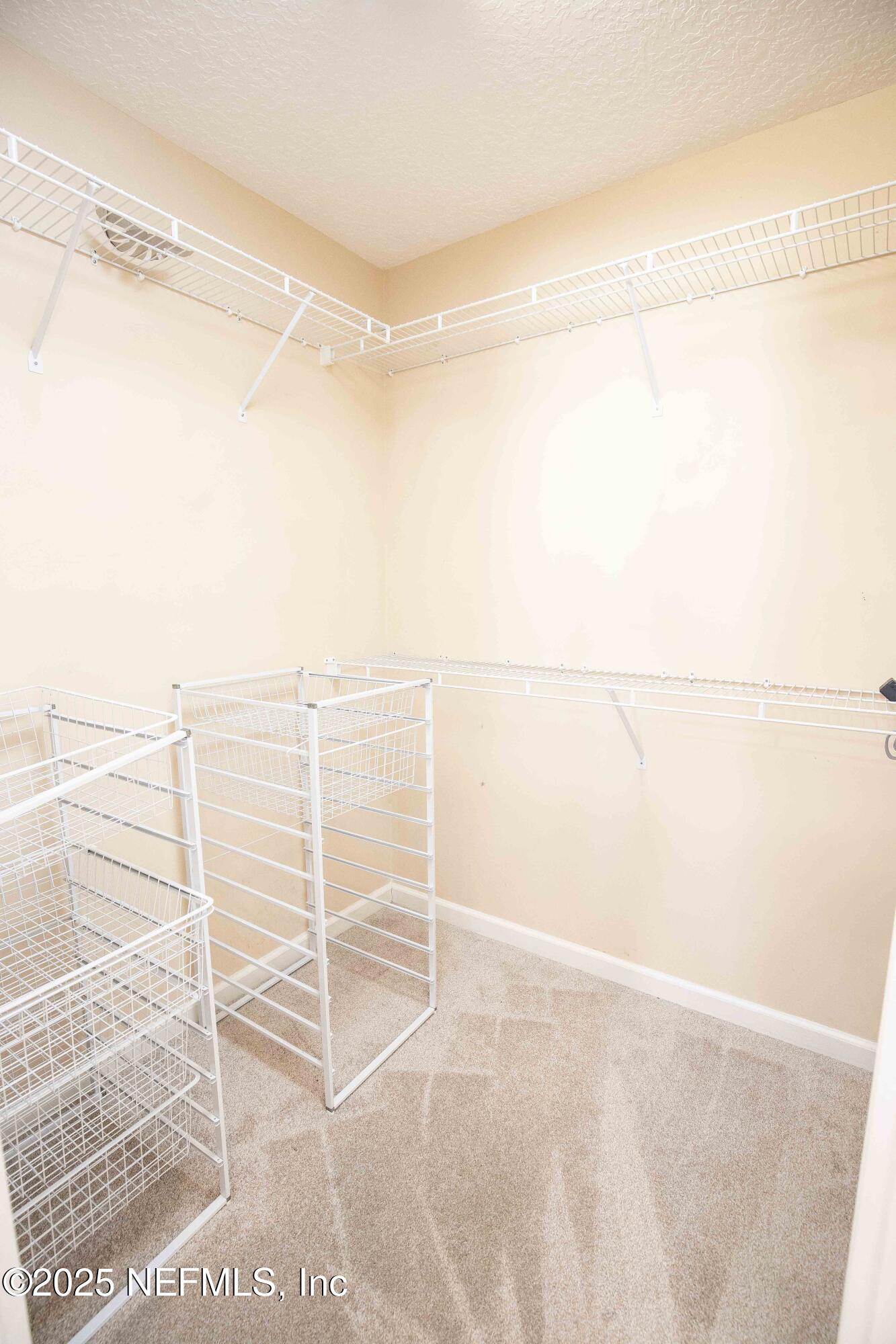 9912 Margate Hills Road Jacksonville, FL 32256 - Photo 10 of 17 a view of a room with racks on the wall