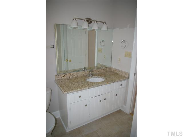 8112 Round Oak Road Raleigh, NC 27616 - Photo 4 of 18 Master vanity with new granite counter top, light fixture, cabinet hardware and faucet