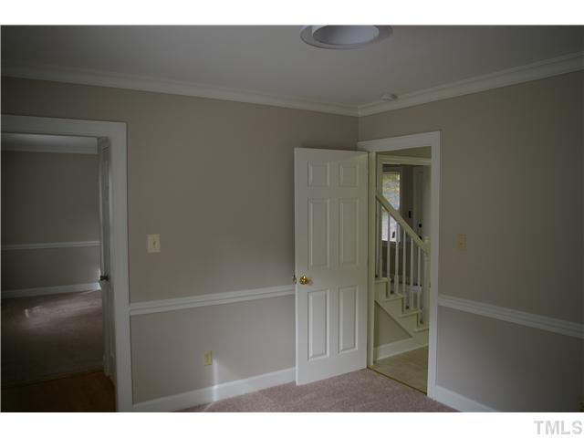 8112 Round Oak Road Raleigh, NC 27616 - Photo 7 of 18 Dining room with new light fixture, chair and crown molding and new paint.