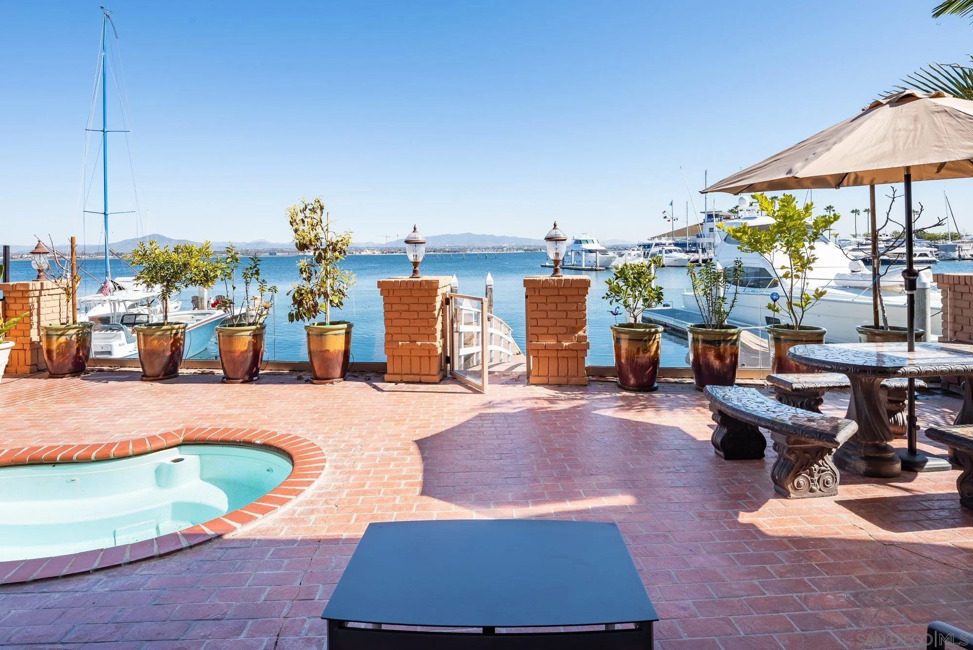 5 Sandpiper Strand Coronado, CA 92118 - Photo 14 of 70 a view of a swimming pool and lounge chairs
