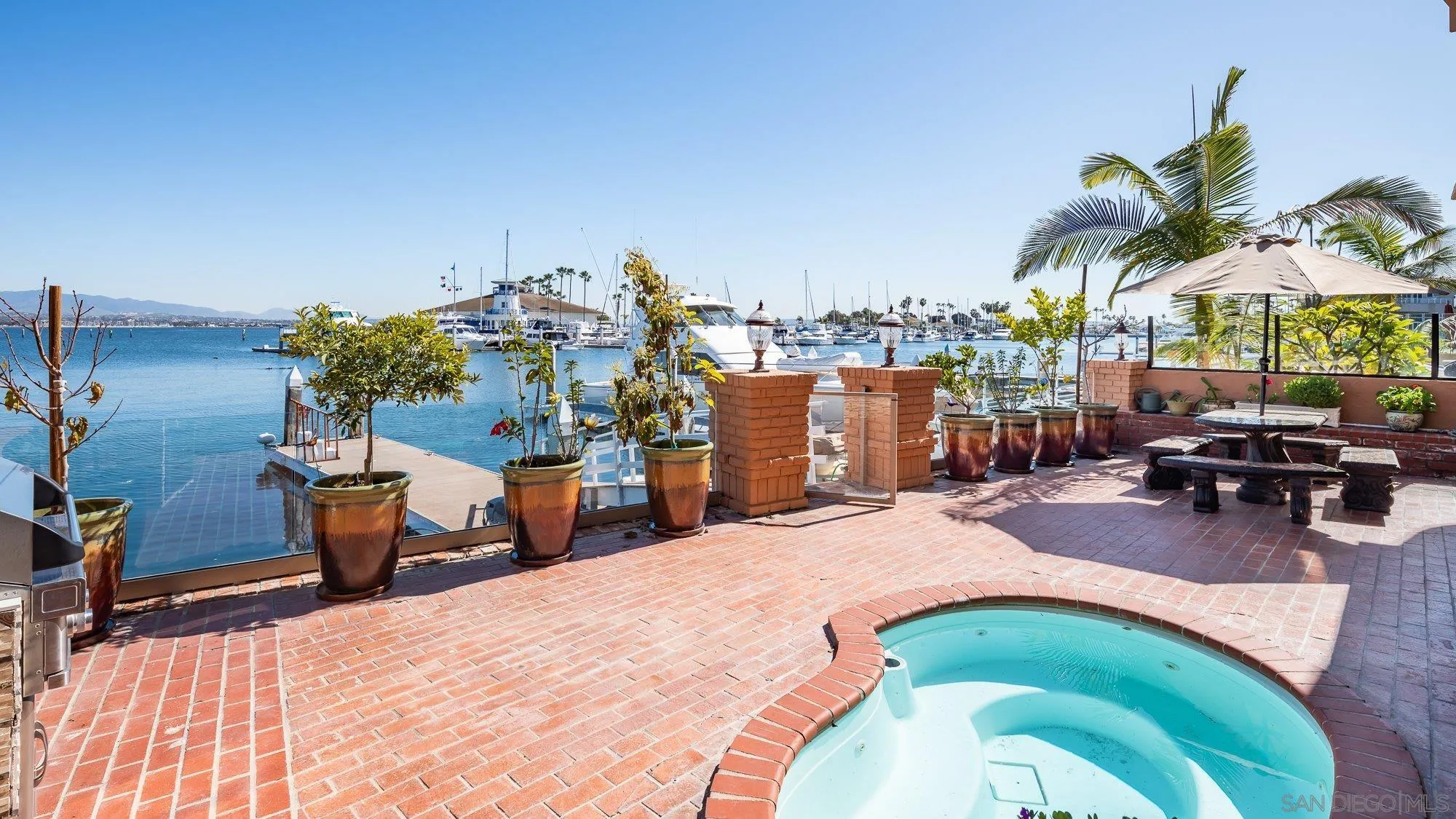 5 Sandpiper Strand Coronado, CA 92118 - Photo 17 of 70 a view of a swimming pool with a lounge chairs