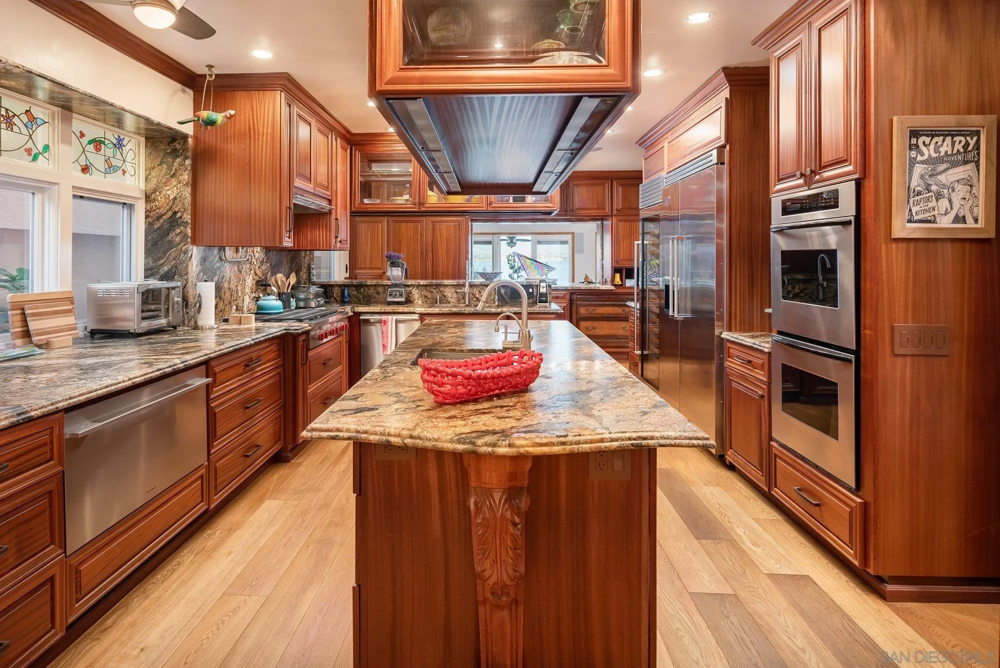 5 Sandpiper Strand Coronado, CA 92118 - Photo 33 of 70 a kitchen with stainless steel appliances granite countertop a sink a stove and a wooden floors