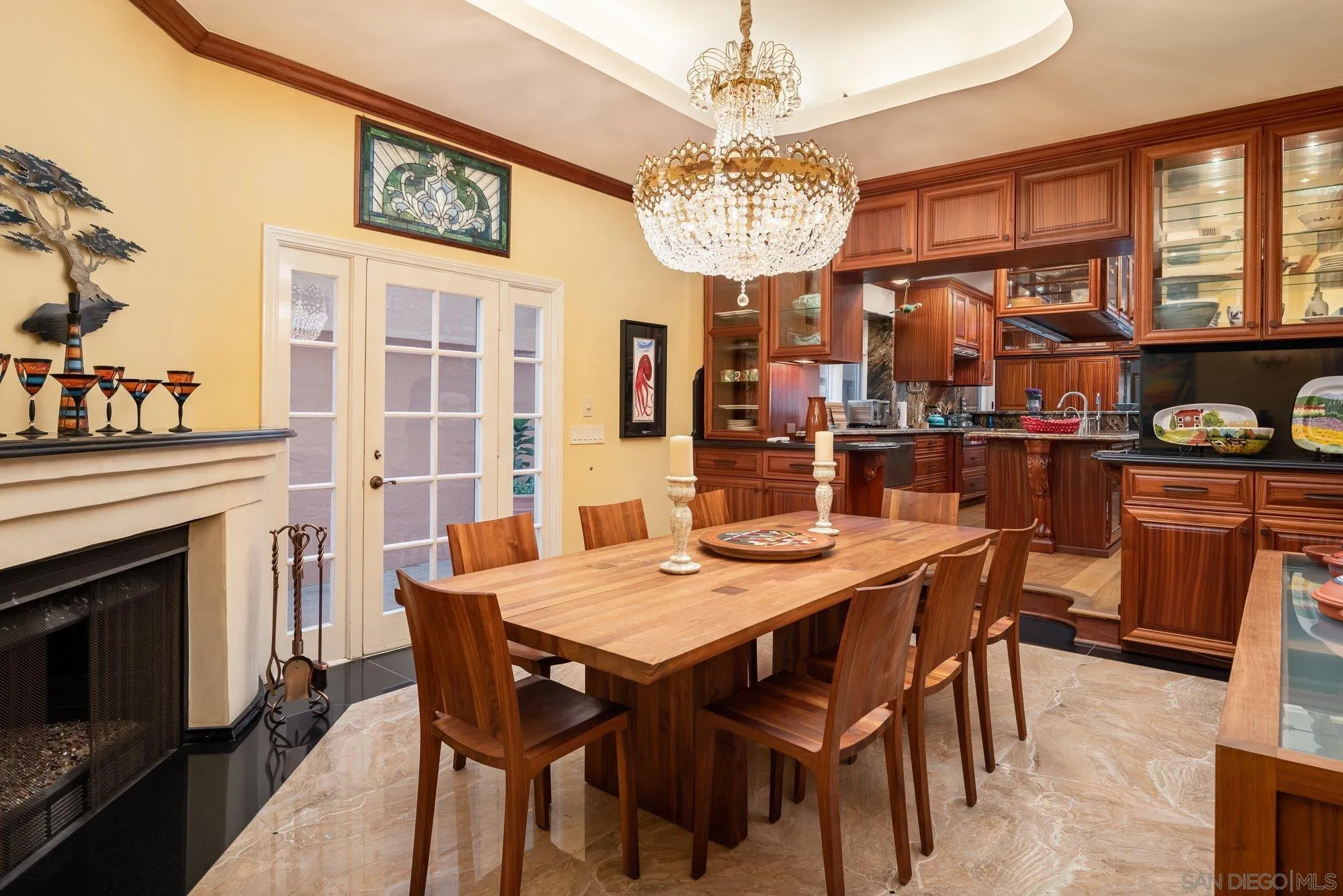 5 Sandpiper Strand Coronado, CA 92118 - Photo 35 of 70 a view of a dining room with furniture a chandelier and wooden floor