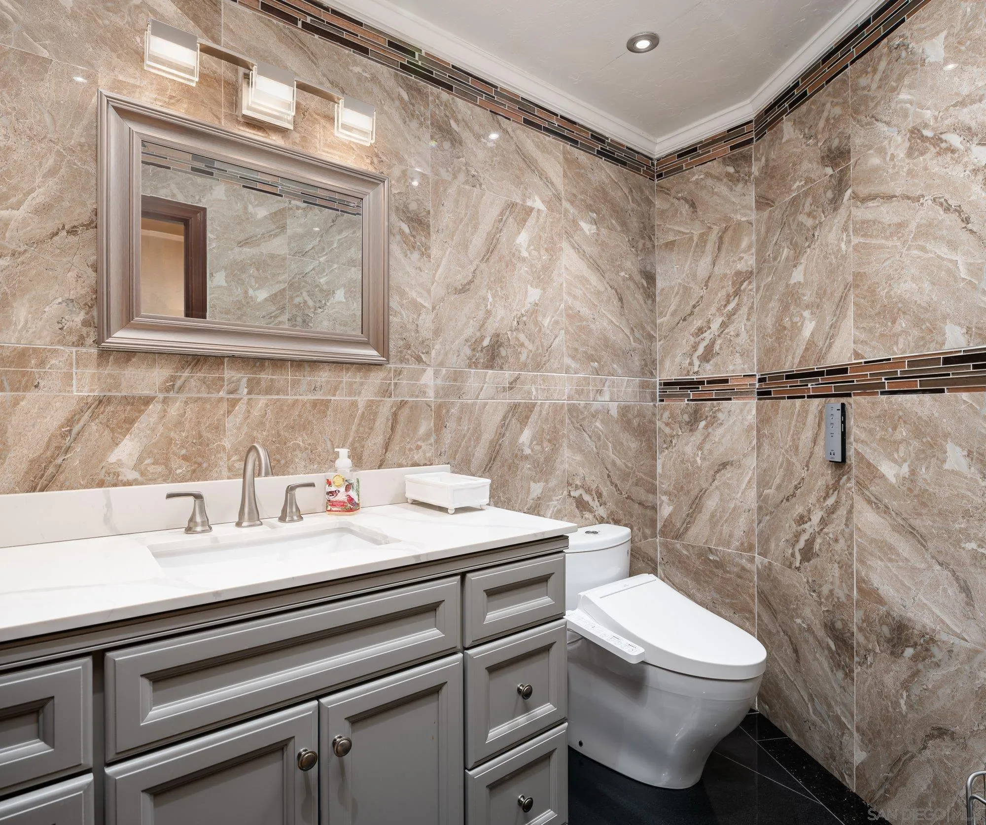 5 Sandpiper Strand Coronado, CA 92118 - Photo 36 of 70 a bathroom with a sink a toilet and shower