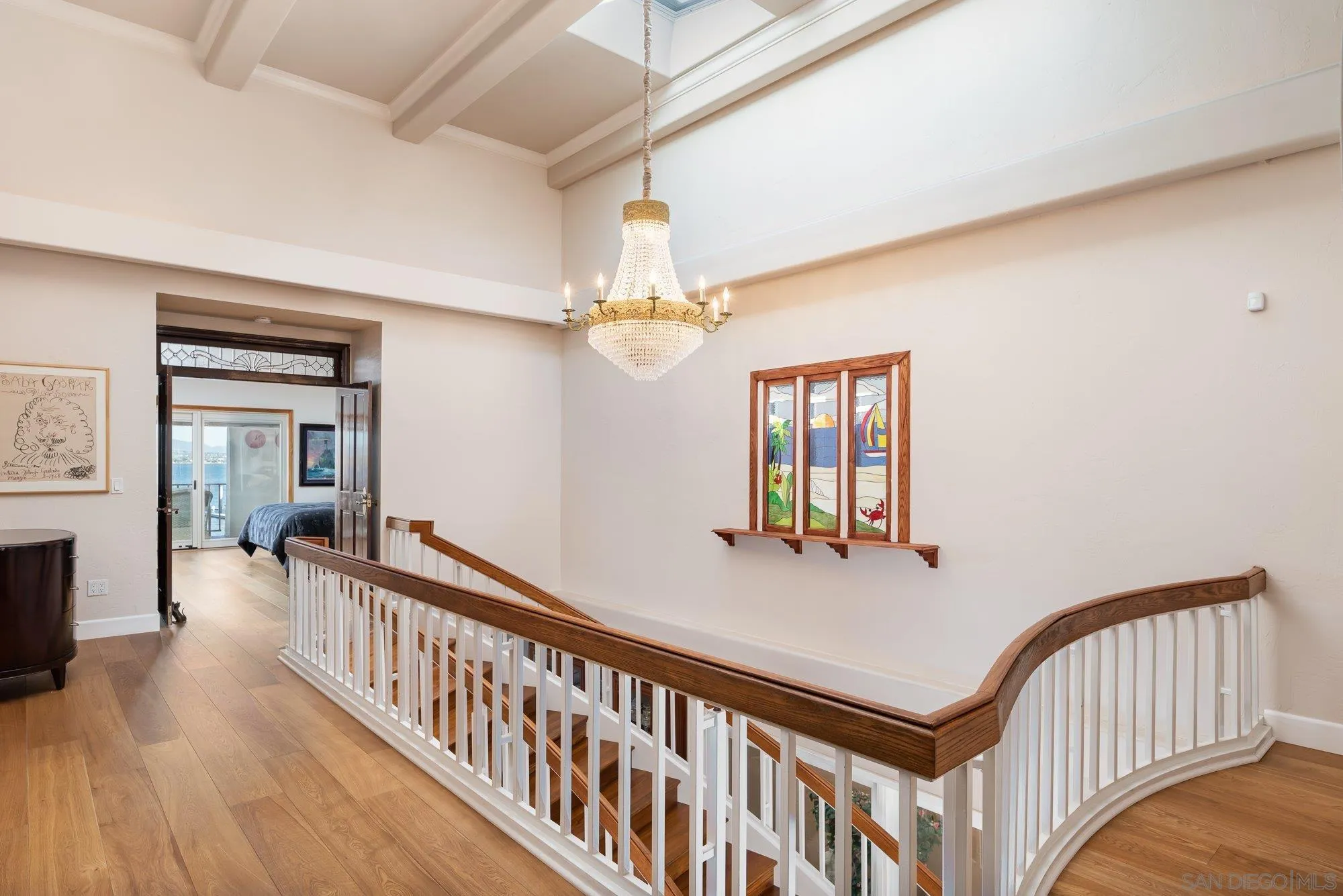 5 Sandpiper Strand Coronado, CA 92118 - Photo 37 of 70 a view of a hallway with wooden floor and staircase