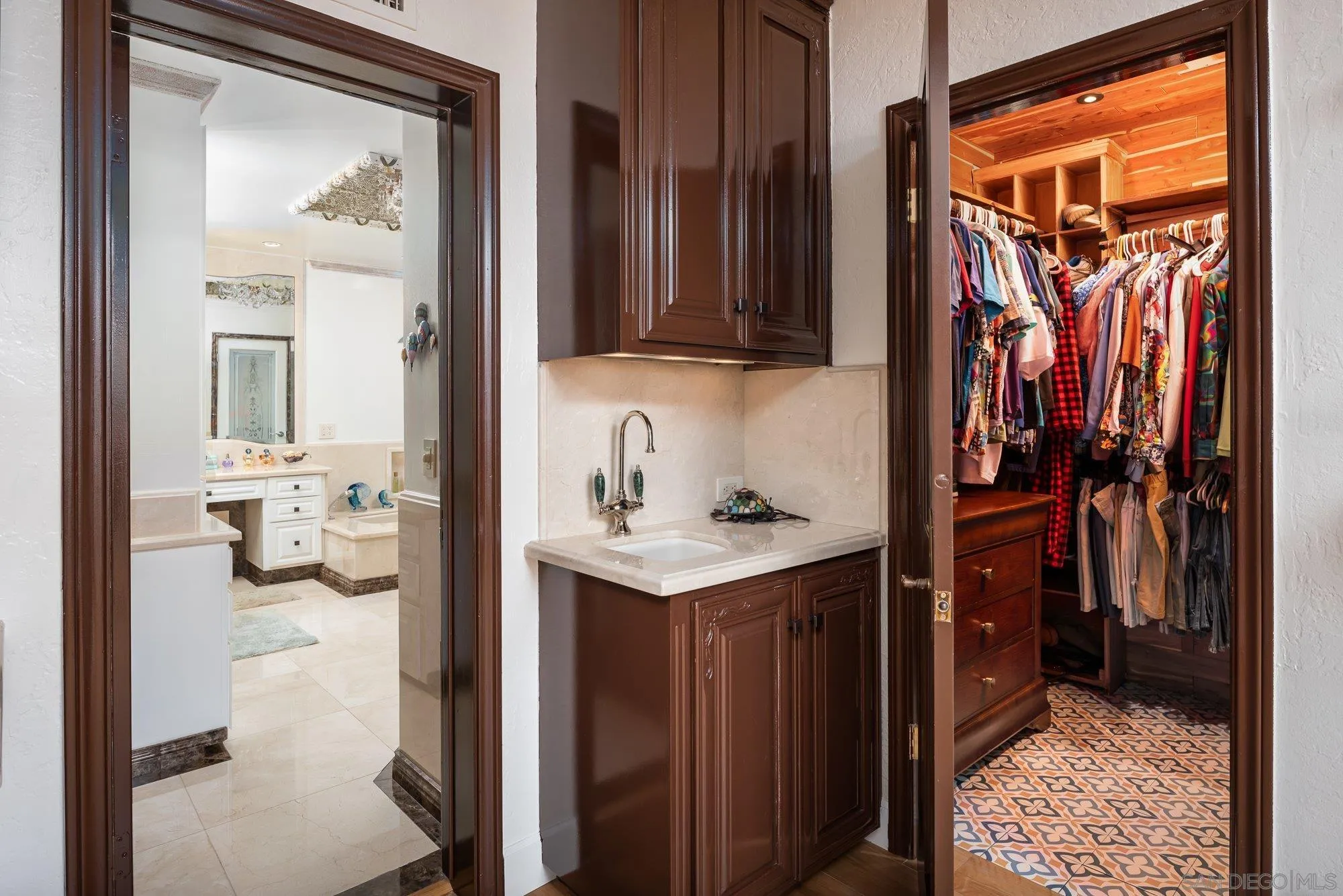 5 Sandpiper Strand Coronado, CA 92118 - Photo 46 of 70 a view of walk in closet with clothes and shoes