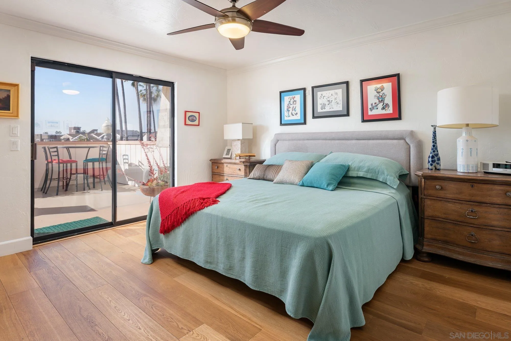 5 Sandpiper Strand Coronado, CA 92118 - Photo 52 of 70 a spacious bedroom with a balcony a bed and a chandelier