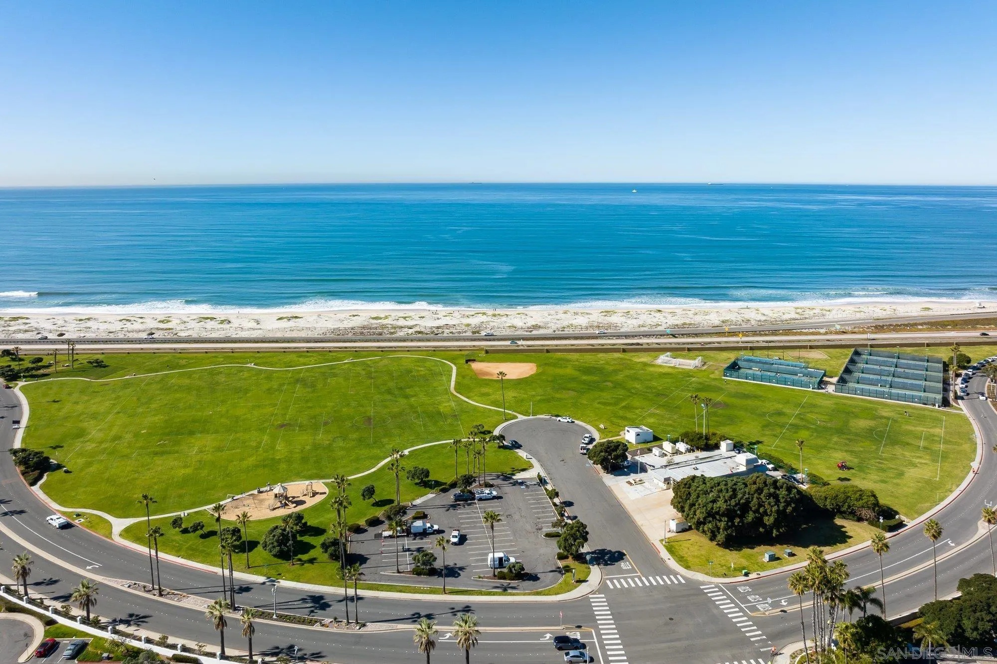 5 Sandpiper Strand Coronado, CA 92118 - Photo 63 of 70 a view of a swimming pool with a outdoor seating