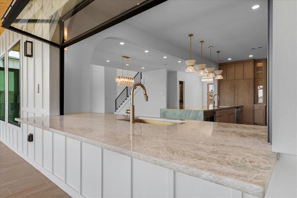 10576 Buccaneer Point Frisco, TX 75036 - Photo 18 of 40 a view of a hallway with a chandelier