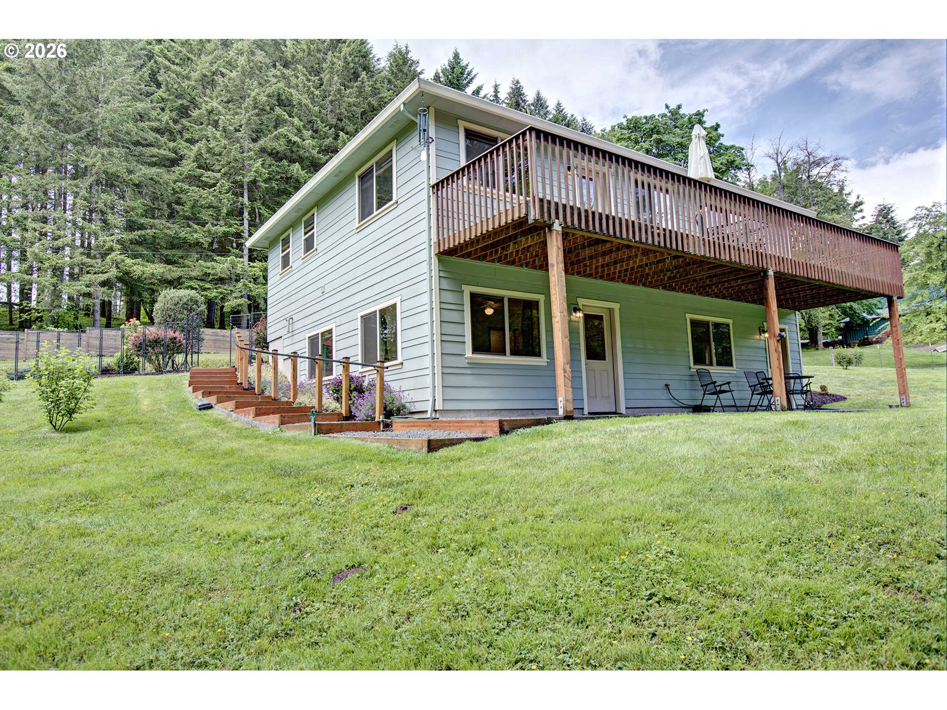 60300 Rays Way St. Helens, OR 97051 - Photo 23 of 41 a view of a house with a backyard porch and sitting area