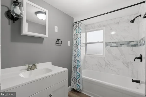 a bathroom with a sink and a shower
