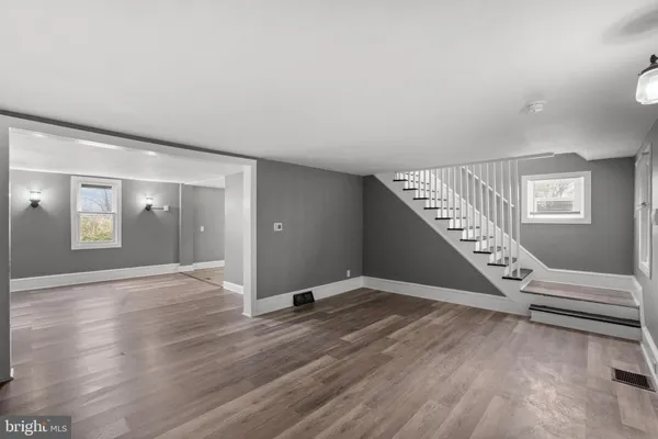 a view of an entryway with wooden floor