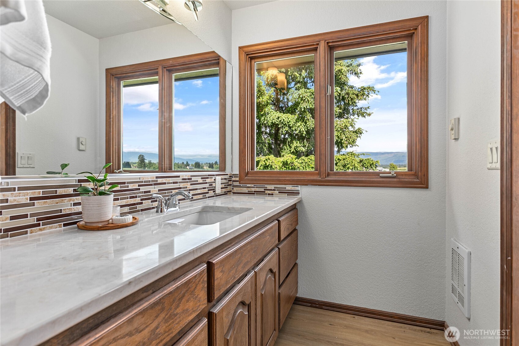 1133 East Pole Road Everson, WA 98247 - Photo 22 of 40 a view of a kitchen with a sink and wooden floor