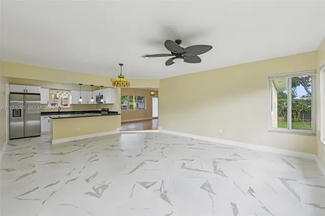 a view of a kitchen with a sink and cabinets