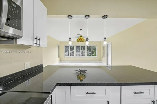 a view of a living room cabinets