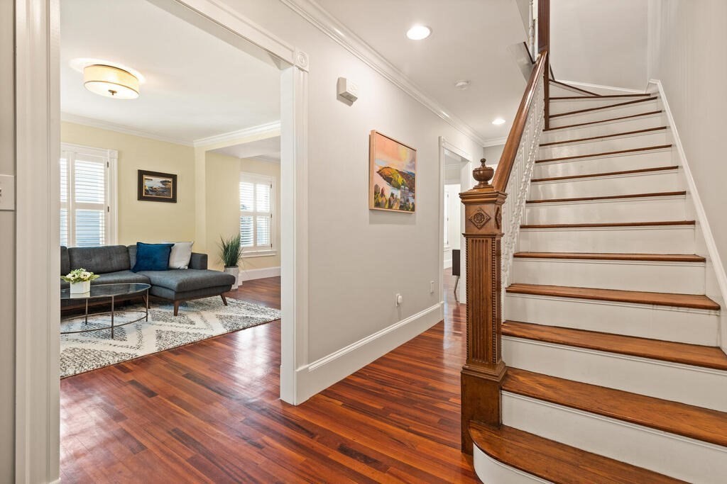 22 Fletcher Street, Unit 22 Winchester, MA 01890 - Photo 12 of 31 a view of entryway and hall with wooden floor
