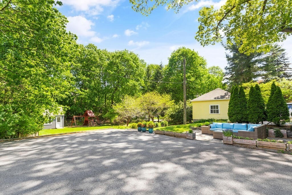 22 Fletcher Street, Unit 22 Winchester, MA 01890 - Photo 24 of 31 a view of an house with backyard and trees