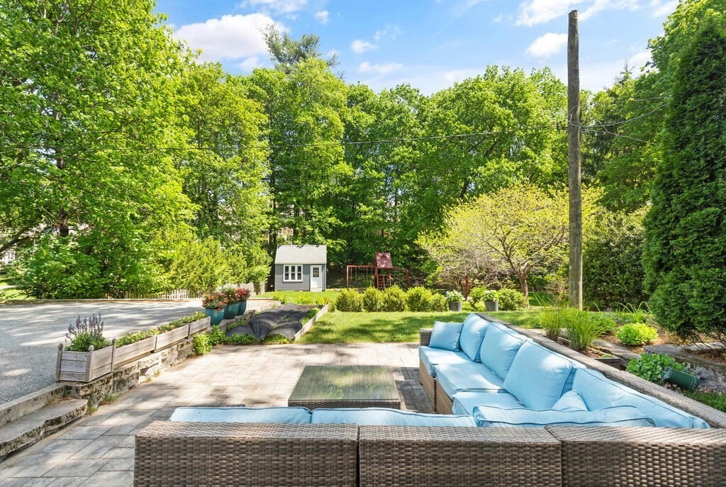 22 Fletcher Street, Unit 22 Winchester, MA 01890 - Photo 25 of 31 a view of a swimming pool with a patio