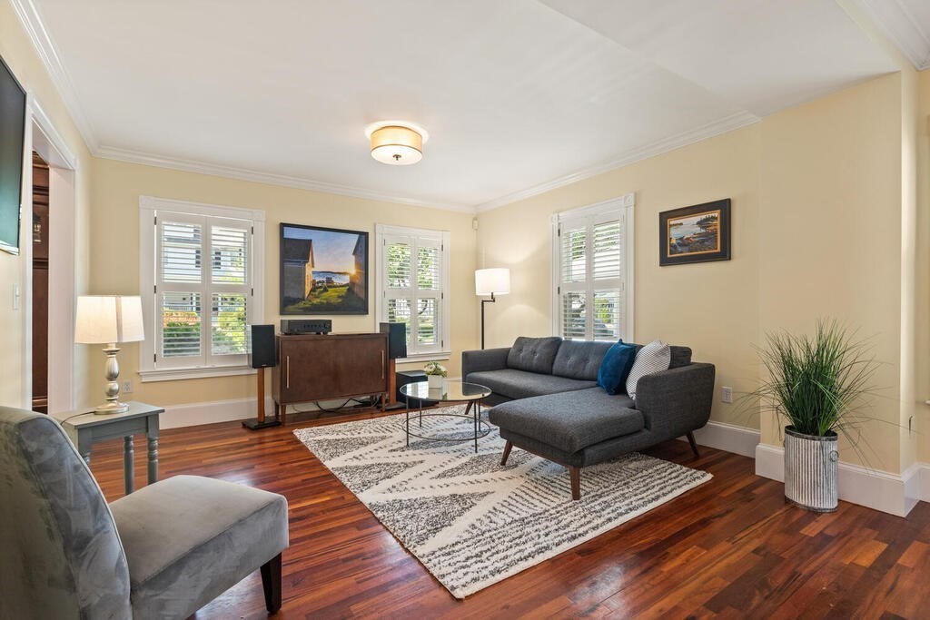 22 Fletcher Street, Unit 22 Winchester, MA 01890 - Photo 6 of 31 a living room with furniture and a rug