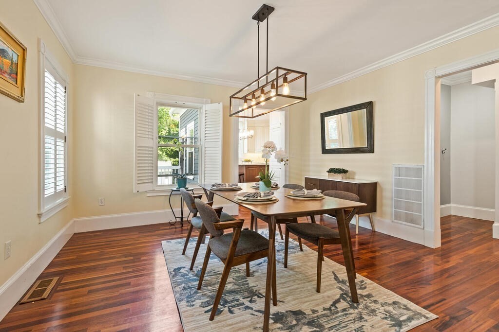 22 Fletcher Street, Unit 22 Winchester, MA 01890 - Photo 7 of 31 a view of a dining room with furniture window and wooden floor