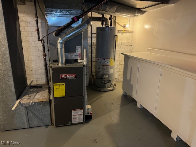 18210 Windward Road Cleveland, OH 44119 - Photo 33 of 40 Utility room with heating unit and water heater