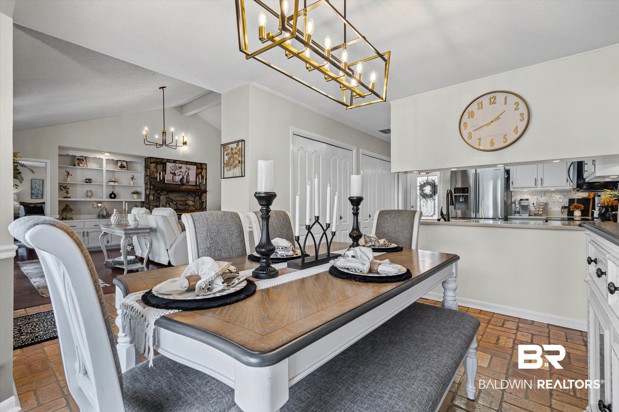 4567 Pine Avenue Saraland, AL 36571 - Photo 8 of 48 Dining room with brick flooring, a chandelier, and vaulted ceiling