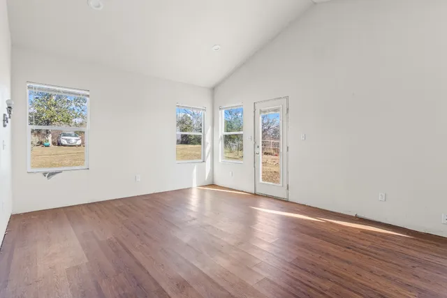 a view of a livingroom with wooden floor