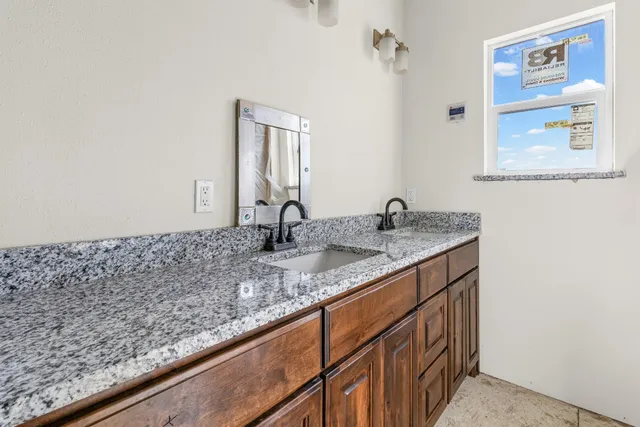 a bathroom with a toilet and a sink