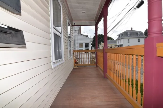 a view of a house with wooden fence