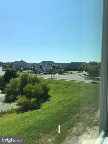 a view of a lake with houses in background