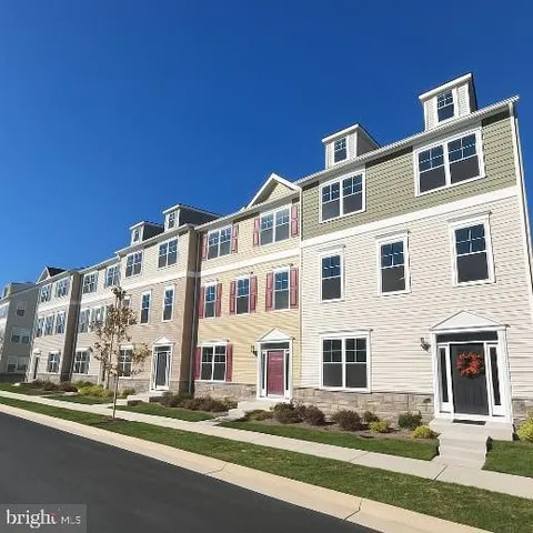 a front view of a building with lot of windows
