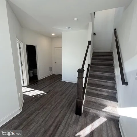 a view of entryway with wooden floor