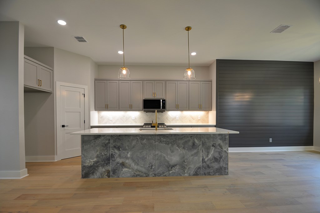513 Conner Court Kerrville, TX 78028 - Photo 15 of 54 a view of a large kitchen with a sink a large window and stainless steel appliances