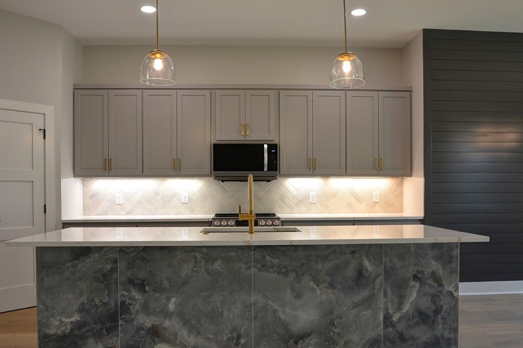 513 Conner Court Kerrville, TX 78028 - Photo 16 of 54 a white cabinet with wide window and wooden floor
