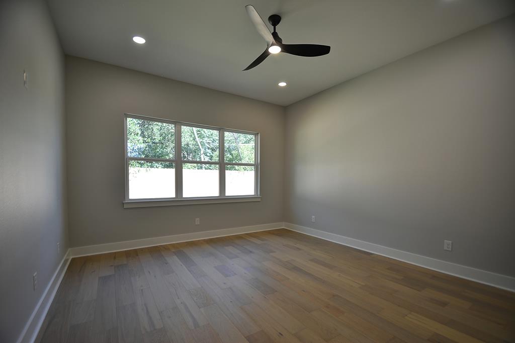 513 Conner Court Kerrville, TX 78028 - Photo 18 of 54 an empty room with wooden floor and windows