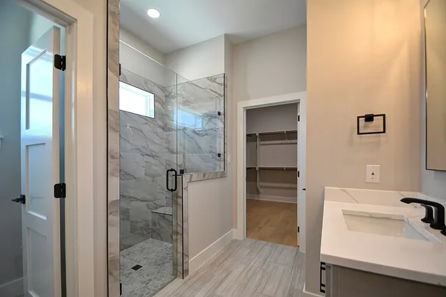 a bathroom with a sink and a shower