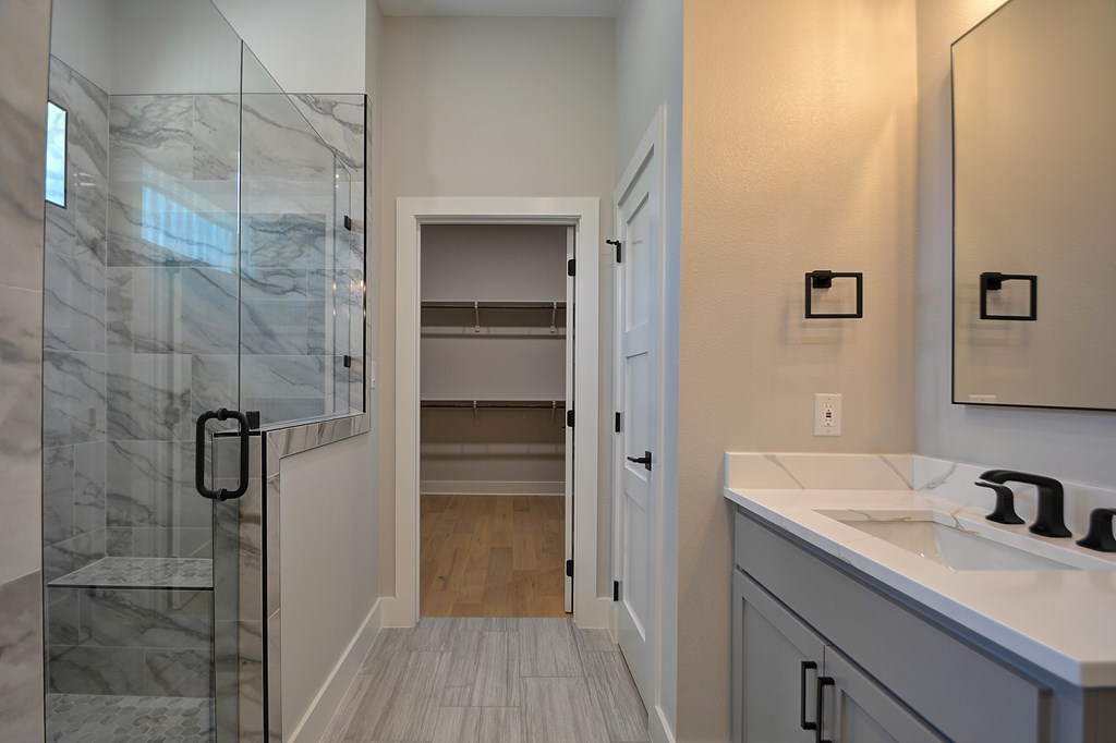513 Conner Court Kerrville, TX 78028 - Photo 26 of 54 a bathroom with a shower sink and mirror