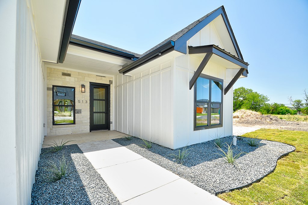 513 Conner Court Kerrville, TX 78028 - Photo 3 of 54 a front view of a house with garden