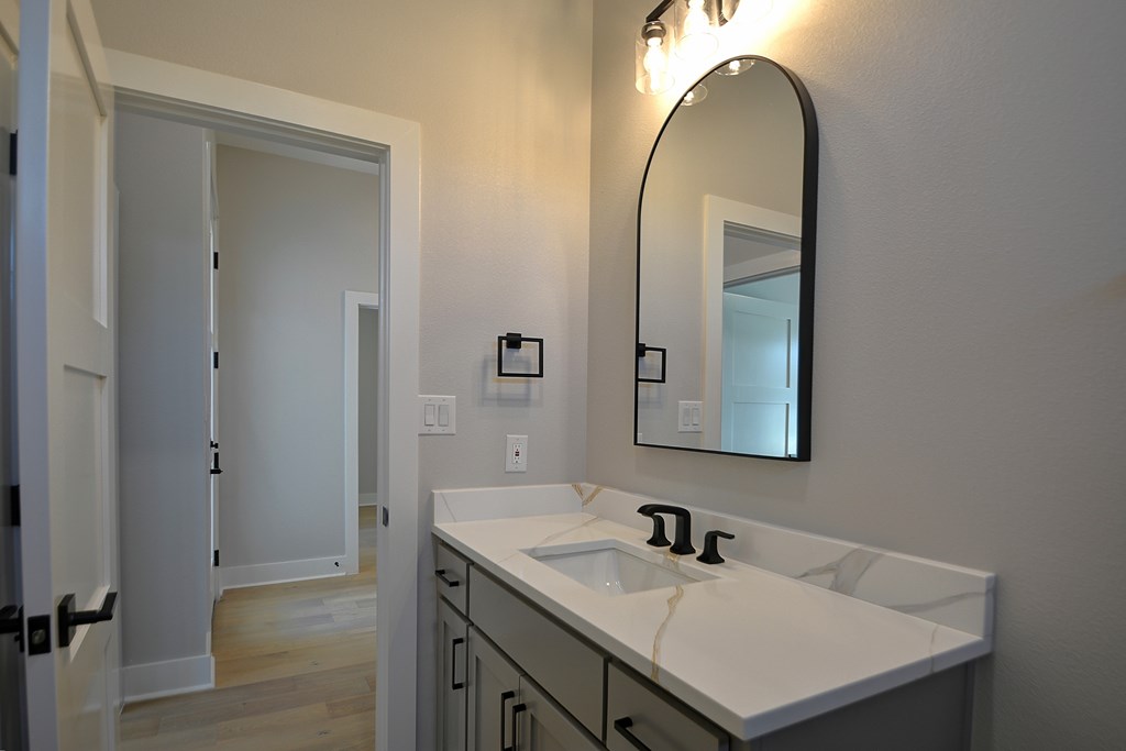 513 Conner Court Kerrville, TX 78028 - Photo 40 of 54 a bathroom with a sink and a mirror