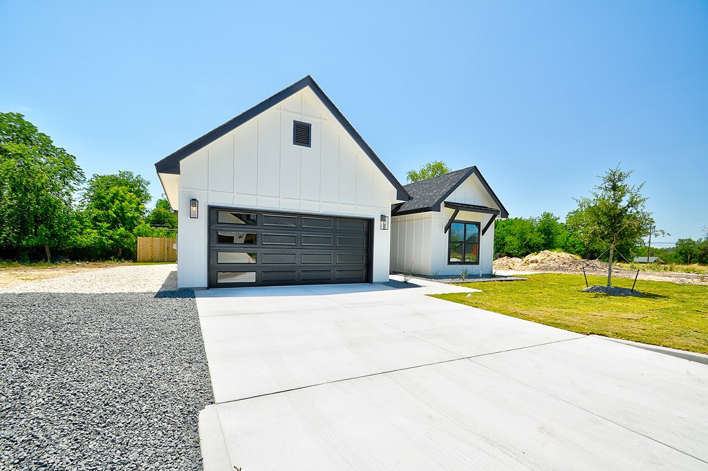 513 Conner Court Kerrville, TX 78028 - Photo 50 of 54 a front view of house with yard and garage