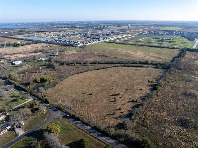 an aerial view of a house with a lake view