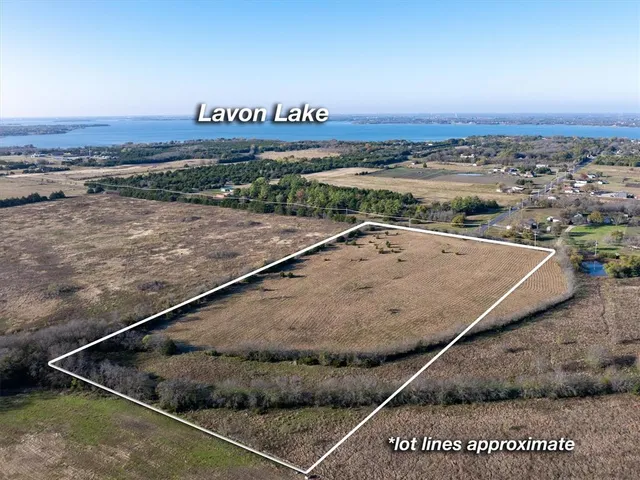 a view of a pool table and chairs in the room