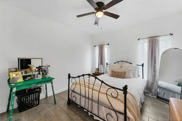 a bedroom with furniture and a window