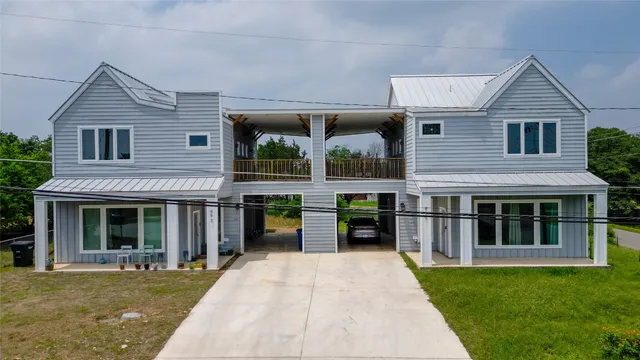 a front view of a house with a yard and porch